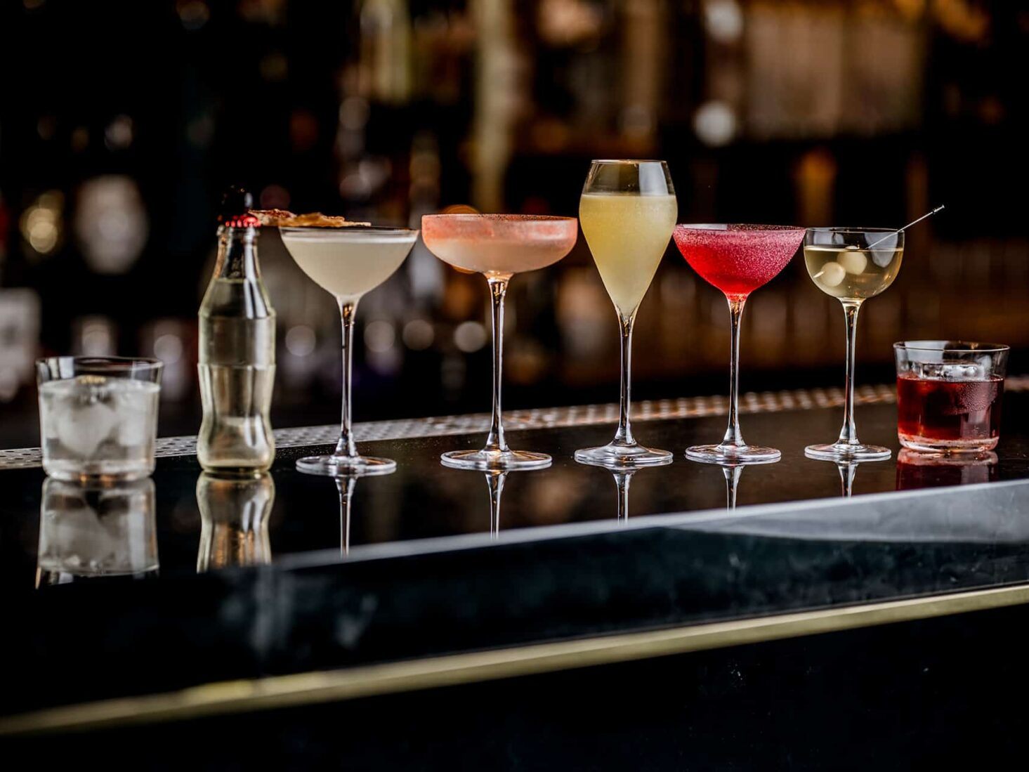A dimly lit luxury cocktail bar